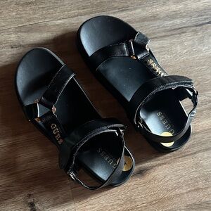 GUESS Black Sandals with Gold Logo Accents